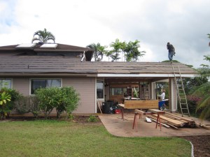 Back lanai roof and new insulated roofing over the rest of the house. Once this has shingles, we'll put the photovoltaic panels back on it. It's a lot cooler and we're going to run our ceiling fans much less!