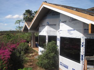 Familyroom and back lanai peaked roofs with new walls and windows. We've already painted some of the eaves and fascia boards. The siding is going on next, followed by us doing more painting.