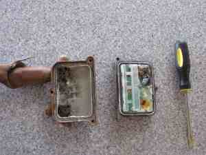 I'm amazed that an electronic waveform could even get through that block of water-soaked rust. Water damage to electronics inside the cable TV connector box