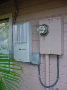 New inverter next to old analog electric meter