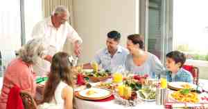 Photo of three generations of family around the dining table | The-Military-Guide.com