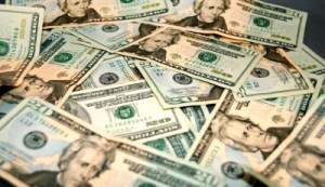 Image of money in a pile of 20 dollar bills | The-Military-Guide.com