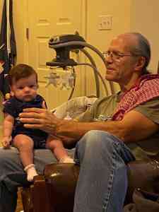 Image of Doug Nordman's granddaughter Arya sitting on his lap. | The-Military-Guide.com