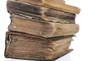 Image of ancient, moldy, ragged hardcover books to make fun of the military's Joint Travel Regulations. | The-Military-Guide.com