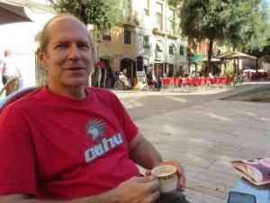 Image of Doug Nordman in the central plaza of Tarragona Spain drinking cafe con leche | The-Military-Guide