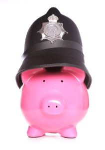 Image of a piggy bank with a police officer's hat representing "The Budget Police." | MilitaryFinancialIndependence.com