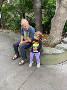 Image of Doug Nordman with toddler granddaughter Arya at the San Diego Zoo | MilitaryFinancialIndependence.com