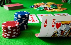 Image of blackjack table with chips and cards, showing that the player is holding an ace and a king of hearts for a blackjack. | MilitaryFinancialIndependence.com